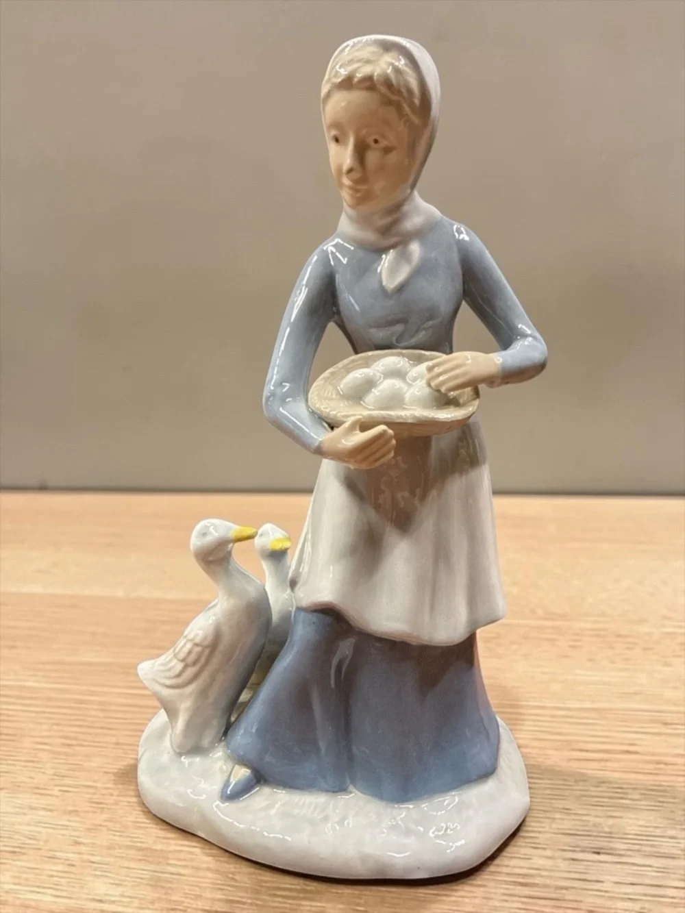 Woman Collecting Eggs with Geese Figurine